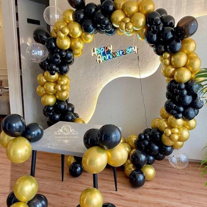 Black and gold anniversary balloon decoration