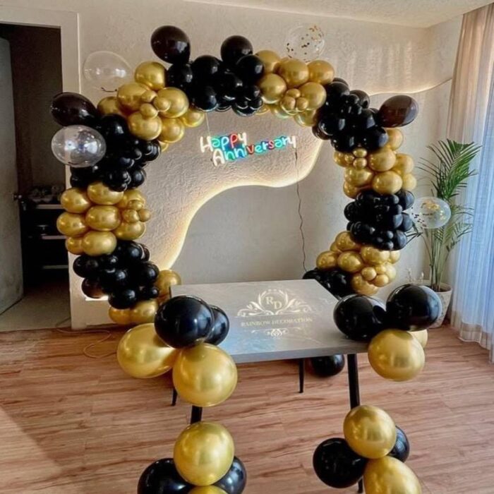 Black and gold anniversary balloon decoration