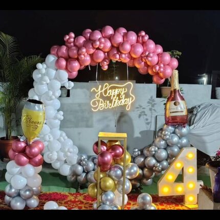 Rose gold, white, and silver birthday balloon arch decoration