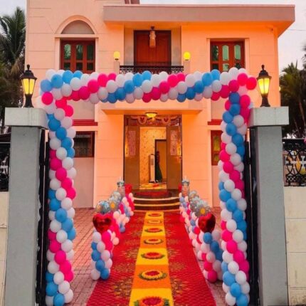 Pink, blue and white balloon arch for housewarming entrance